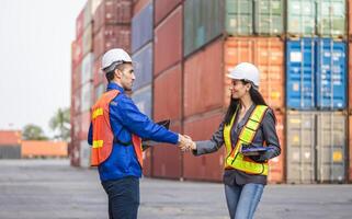 Logistics Team Discussion at Shipping Yard, Engineers Foreman and Businesswoman doing Handshake in Industry Containers Cargo, Success and Teamwork concepts photo