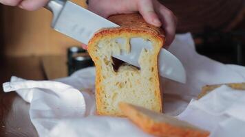 Slicing fresh homemade bread, soft airy texture with a golden crispy crust video