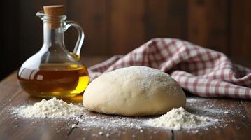 Dough preparation on a wooden surface with oil and flour in a rustic kitchen photo