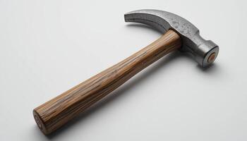 hammer with a metal head and a wooden handle lies on a white background. An ideal tool for construction and repair, combining durability and functionality. photo