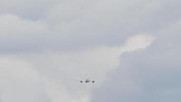 Long shot rear view jet passenger plane climbing in blue sky. Airliner gaining altitude, flying away. Travel concept video