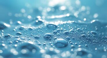 Close up of turbulent water with bubbles and surface tension under a clear blue background photo