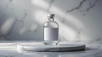 Clear Glass Bottle with Blank Label on Marble Surface in Dimly Lit Background. photo