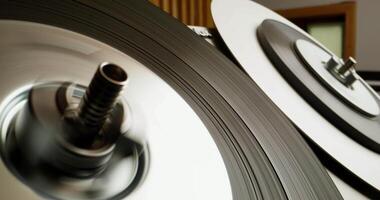 A close up of a record player with a spinning record video