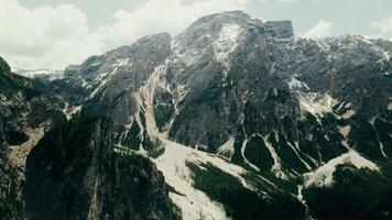 The mountain range is lined with snow covered peaks. video