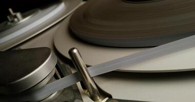 A close up of a record player with a tape video