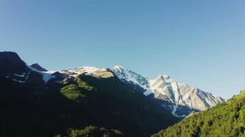 The mountain range boasts snow capped majestic peaks. video