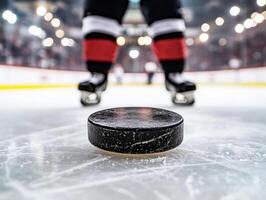 Focus on hockey puck at center ice during intense game moment photo