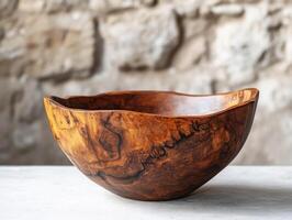 Handcrafted wooden bowl showcasing unique grain patterns photo