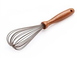 Whisk with wooden handle on white background for kitchen use photo