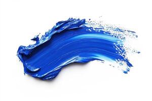 Bright blue paint stroke on white canvas showing artistic texture photo