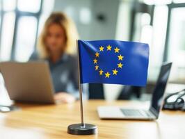 European Union flag displayed on desk in modern office setting photo