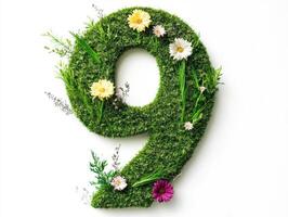 Number nine crafted from grass and flowers in a natural setting photo