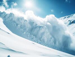 Snow avalanche cascades down a mountain slope in bright sunlight photo
