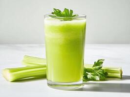Refreshing green juice made from fresh celery stalks photo