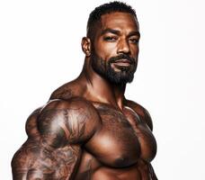 Muscular man poses confidently with tattoos in a studio setting photo