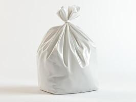 White garbage bag filled with trash in a clean environment photo
