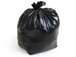 Black trash bag filled with waste on a white background photo
