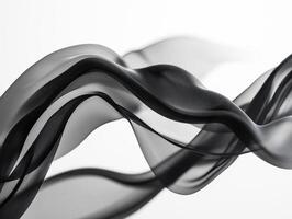 Black fabric forms elegant patterns on a light backdrop photo