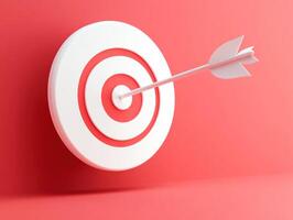 Arrow hits target on vibrant red background photo
