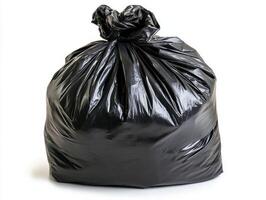 Black trash bag filled with waste collected for disposal photo