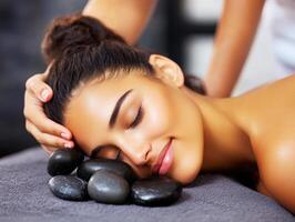 Relaxing experience with hot stones during a wellness session photo