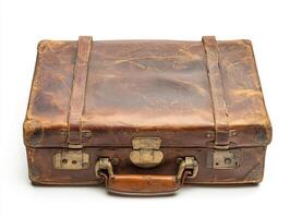 Vintage leather suitcase with worn exterior and classic design photo