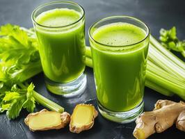 Refreshing green juice made from celery and ginger in glasses photo