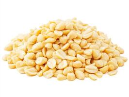 Raw macadamia nuts piled on a white background in daylight photo
