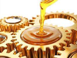 Engine oil being poured onto golden gears in mechanical setup photo