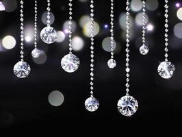 Sparkling crystal ornaments hanging against a dark background photo