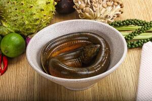 A bowl of food with a snake in it photo