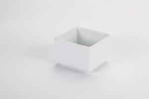 A white square container with a small lid photo