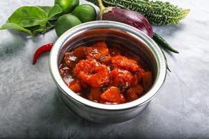 A silver container with food in it photo