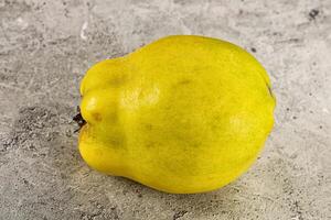 A yellow fruit on a table photo
