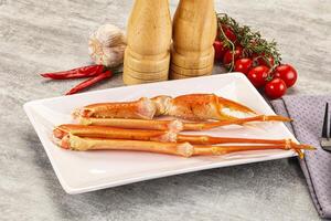 A plate with two cooked crabs on it photo