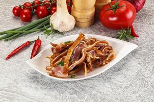 A plate of food with bacon and tomatoes photo