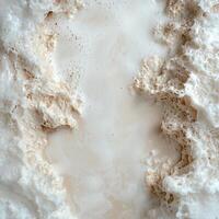 Close up of frothy liquid with bubbles and texture, creating an abstract and organic pattern photo