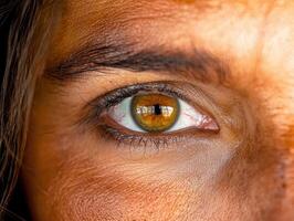 Close up of a human eye with striking amber iris photo