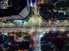 Top view of Evening Rush Hour Traffic at an Intersection in Hanoi, Vietnam. photo