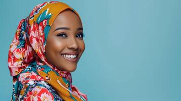 A smiling woman wearing a colorful headscarf photo