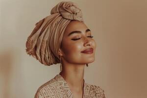A woman wearing a turban and smiling photo