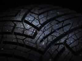 A close up of a tire with cracks on it photo