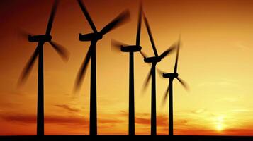 Silhouetted Wind Turbines at Sunset Clean Energy Power Generation photo