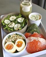 Healthy Breakfast Platter Smoked Salmon, Soft Boiled Eggs, and Green Salad photo