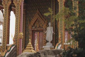 A beautiful Buddha statue in an ornate temple radiates tranquility, inviting reflection photo