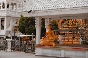 Golden Buddha Statue Majestically Set in a Serene Temple Landscape at Dusk, a True Wonder photo