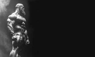 Bodybuilder showcasing impressive physique at competition stage during intense spotlight. Header banner mockup with copy space. photo