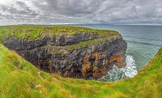 Breathtaking view of the Cliffs of Moher overlooking the Atlantic Ocean in Ireland 8 photo