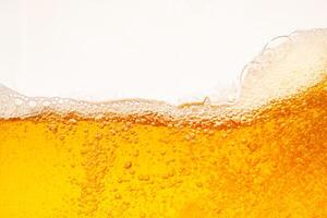 Close up bright orange Oil or beer splash texture and nature waves, Beautiful waves curve and little bubbles smooth for graphic design and background, Oil Bubbles, Soft beer photo